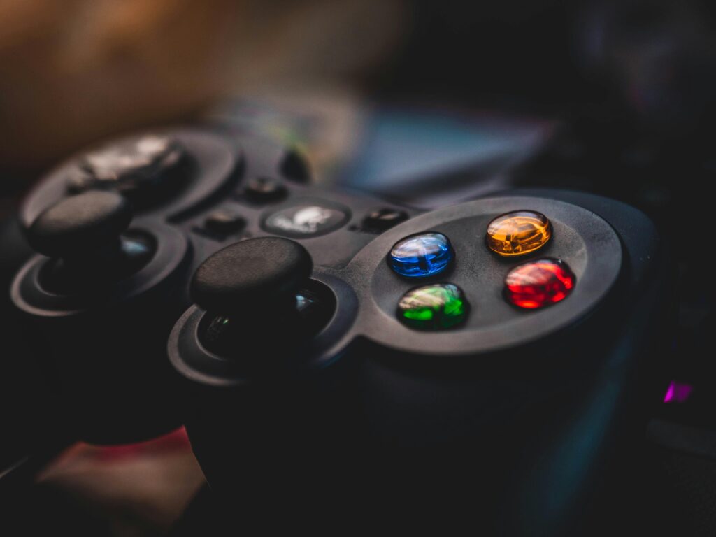 Detailed shot of a gaming controller featuring colorful control buttons and joysticks.